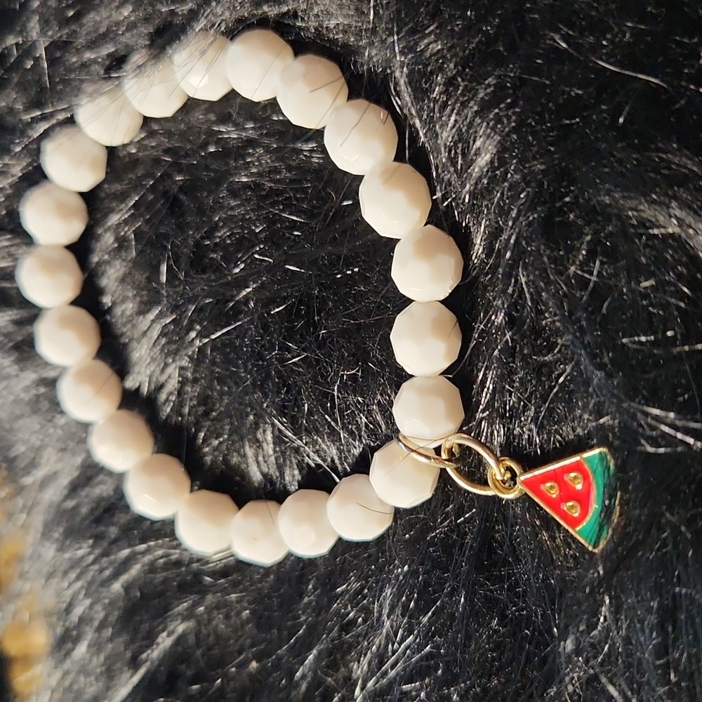 By Krafty_Korner Hand Crafted Charm bracelet made on a stretchy cord